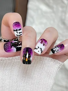 Detail of purple gradient Halloween nails featuring bat and gothic castle patterns