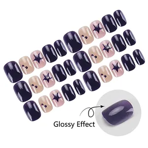 Short square press-on nails in deep purple and pink with stars and crystal accents