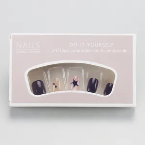 Detail view of deep purple and star pattern press-on nail kit in compact packaging