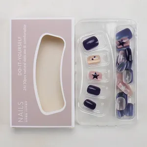 Macro view of purple star press-on nail kit with cat-eye glitter finish and DIY packaging