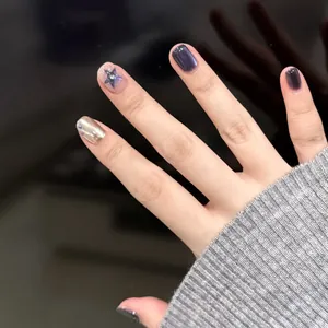 Short dark purple press-on nails with silver mirror effect and star glitters