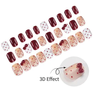 Short square burgundy press-on nails with red dots and 3D bow accents set