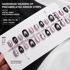 Short French press-on nails with purple cat eye effect and black stars on display