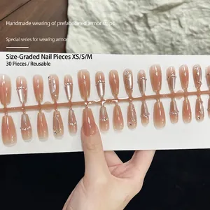Handmade nude pink gradient coffin press-on nails with pearls and diamond accents