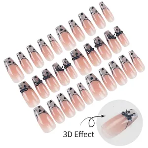 Handmade coffin press-on nails with nude pink gradient, black bows and heart designs