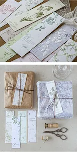 Detail of floral embossed bookmarks with vintage packaging and retro aesthetic items