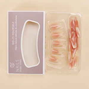 Macro detail of 30pcs gradient nude pink press-on nails in purple DIY packaging box