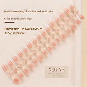 Short ballet style pink and white ombre press-on nails with cat eye finish and checkered design