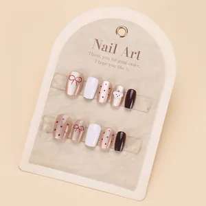 Cute Japanese style handmade press-on nails with 3D white bear and bow tie design