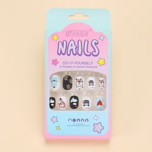 Close-up of cute cartoon press-on nails for kids featuring bear and daisy patterns
