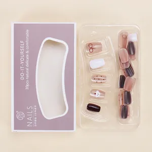 Detail view of 30pcs cartoon cat eye press-on nails in light purple packaging box