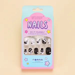 Detailed view of 24pcs cute black and white cat press-on nails in retail window box