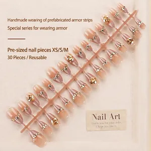French cat-eye press-on nails with sparkling rhinestones in nude pink gradient