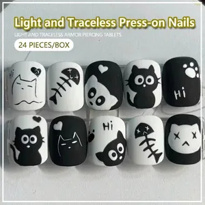 Black and white cartoon cat press-on nails set for girls with heart and paw motifs 24pcs