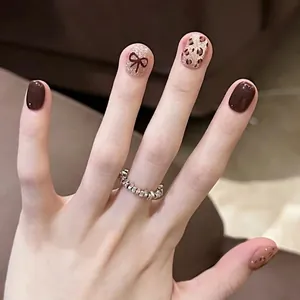 Set de uñas postizas ojo de gato marrón leopardo con lazos 3D y brillo elegante