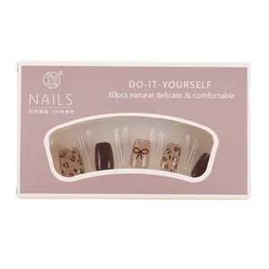 Set de 30 uñas postizas con estampado de leopardo, color marrón chocolate y lazos en caja