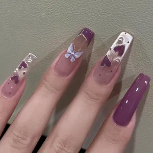 Handmade cat-eye press-on nails with purple hearts, pearls, and butterfly 3D charms