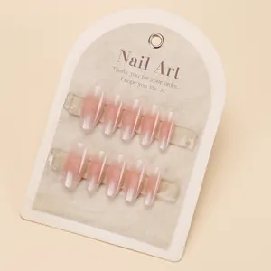 Elegant cat-eye press-on nails in nude pink gradient design on a gray display card