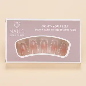 Detail of pink gradient cat-eye press-on nails in a professional 30-piece box