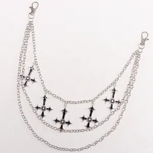 Close-up of three-layered metal trousers chain with black enamel star cross pendants