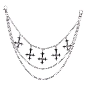 Multilayer silver metal waist chain with black inverted cross pendants and star details