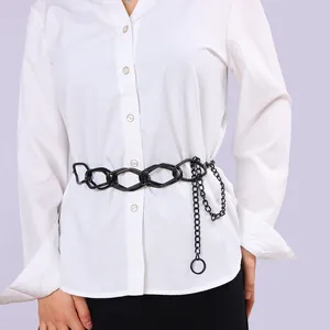 Fashionable black chunky geometric link waist chain styled on a white shirt for women