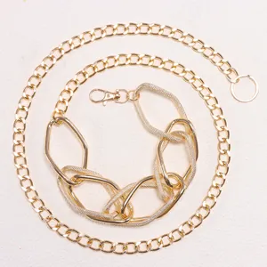 Detail of multi-layered chunky gold geometric chain links with lobster clasp closure