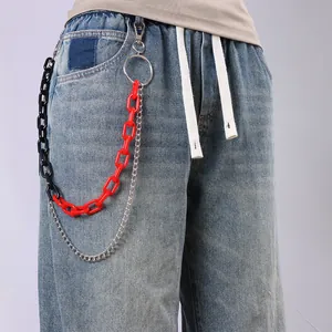Close-up of three-layered street style hip-hop pant chains with red and black acrylic