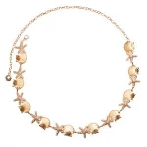 Bohemian gold waist chain featuring starfish, shell charms and faux pearl accents