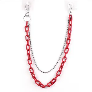 Detail of red acrylic chain and silver bead link with metal lobster clasps for accessories