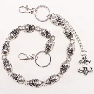 Gothic skull chain belt with retro silver metal links and fleur-de-lis pendant detail