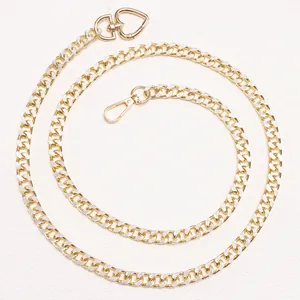 Fashionable gold metal chain belt featuring a heart-shaped buckle and lobster clasp