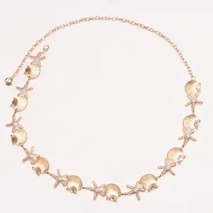 Gold bohemian waist chain with metallic starfish, seashells and white pearl accents