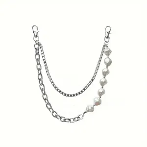 Detail view of triple-layered silver hip hop waist chain with mixed pearls and metal links
