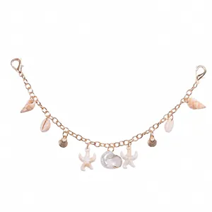 Detailed view of ocean-themed charm chain featuring starfish and resin shells on gold alloy