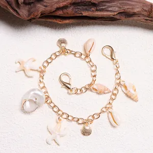 Golden ocean theme chain jewelry set with starfish, seashell charms and conch pendants