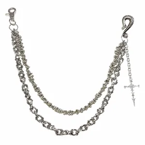 Detail of double-layer skull pants chain with cross pendant and alloy metal hooks