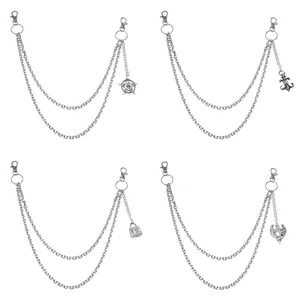 Detail of double-layered silver hip-hop pant chains with star and eagle pendants
