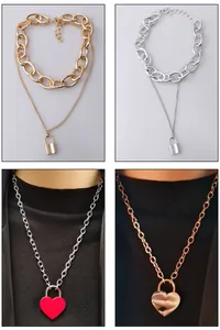 Detail of vintage layered necklaces with key lock and heart charms in multiple finishes