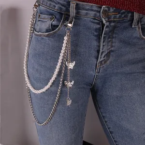 Double-layered hip hop waist chain with pearls and silver butterfly charms on denim