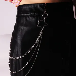 Close-up of triple-layered silver metal pants chain with star hook on black PU skirt