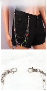 Detailed macro view of triple-layered metal pant chain with colorful jelly bear charms