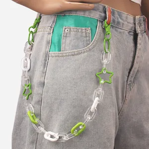 Hip hop punk style colorful acrylic waist chain with green stars on white jeans