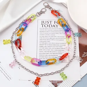 Detail of layered hip-hop pant chain with colorful acrylic links and gummy bear charms