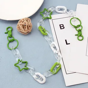 Detail of green and white acrylic link chain with star accents and metal spring clasps