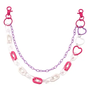 Detail of multi-layered pink acrylic heart chains with metal hooks for pants and bags