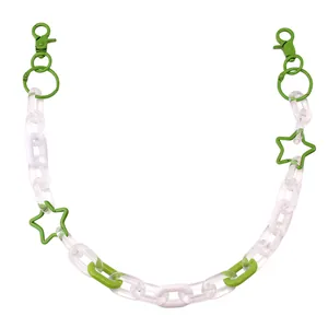 Detailed view of green acrylic star charms on punk style hip hop metal pants chain