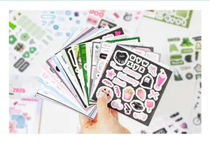 Detail of deco sticker book showing diverse themes like months, letters and cute food