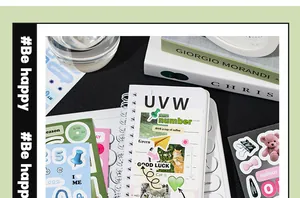 Detailed macro shot of aesthetic deco sticker book with bear and cat motifs for journaling