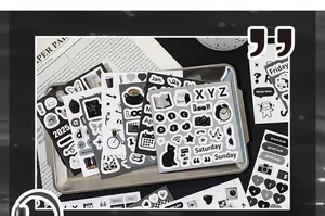 Macro shot of minimalist black and white deco sticker book set for journal collage